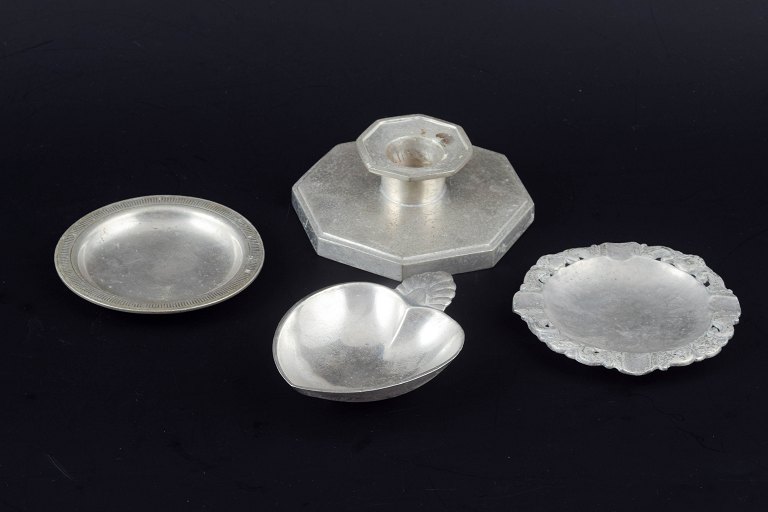 Just Andersen, Denmark.
Collection of three small pewter dishes and a candlestick.