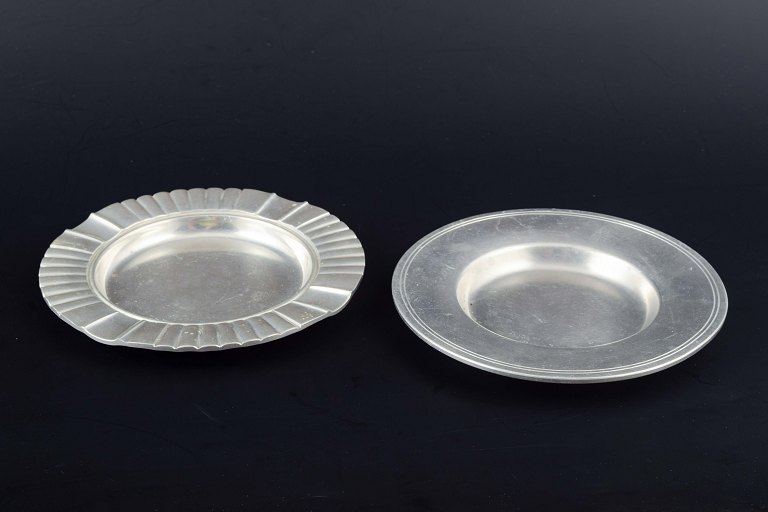 Just Andersen, Denmark.
Two pewter dishes, one with fluted rim, the other with simple profiling.