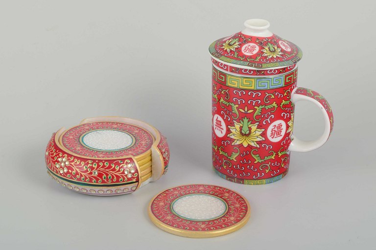 Chinese porcelain
Tea set with mug and tea strainer and six bottle-/glass-coasters, ca. 1980/90s